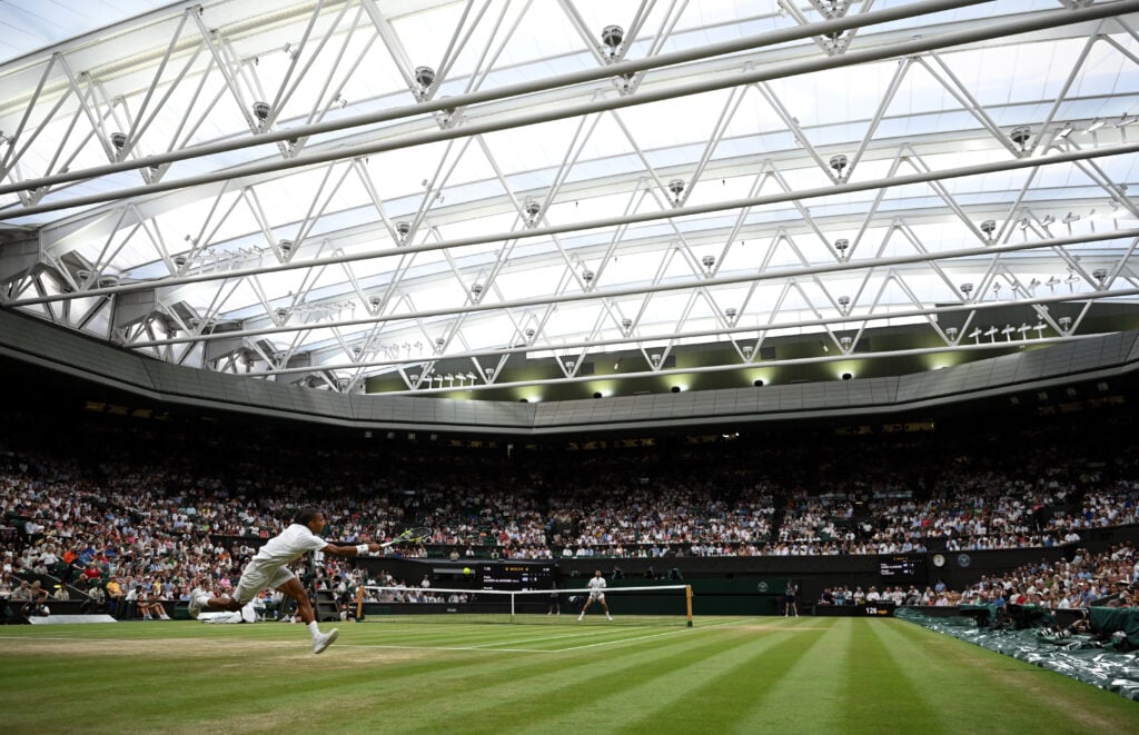 A general view of Centre Court under the roof as Felix Auger-Aliassime of Canada plays a forehand against Novak Djokovic of Serbia during their Gentlemen's Singles quarterfinal match on day nine of The Championships Wimbledon 2026 at All England Lawn Tennis and Croquet Club on July 07, 2026 in London, England.