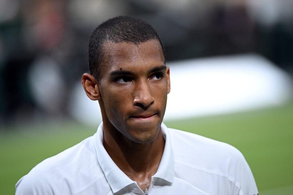Felix Auger-Aliassime looks on during his match against Novak Djokovic at Wimbledon in 2026.