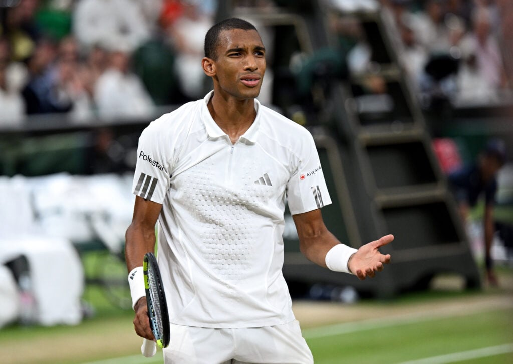 Felix Auger-Aliassime reacts during his defeat to Novak Djokovic at Wimbledon in 2026.