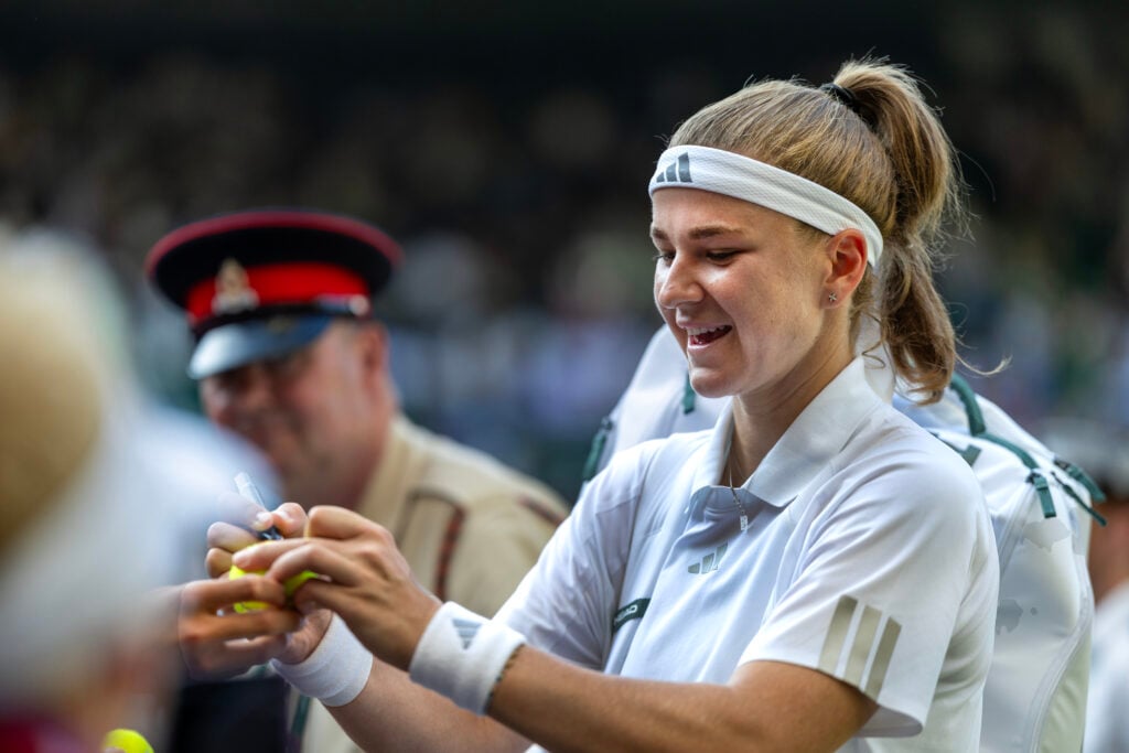 Karolina Muchova of the Czech Republic signs autographs after her victory against Naomi Osaka of Japan in the quarter-final round of the Ladies' Singles Competition on No.1 Court during the Wimbledon Lawn Tennis Championships at the All England Lawn Tennis and Croquet Club at Wimbledon on July 7th, 2026, in London, England.