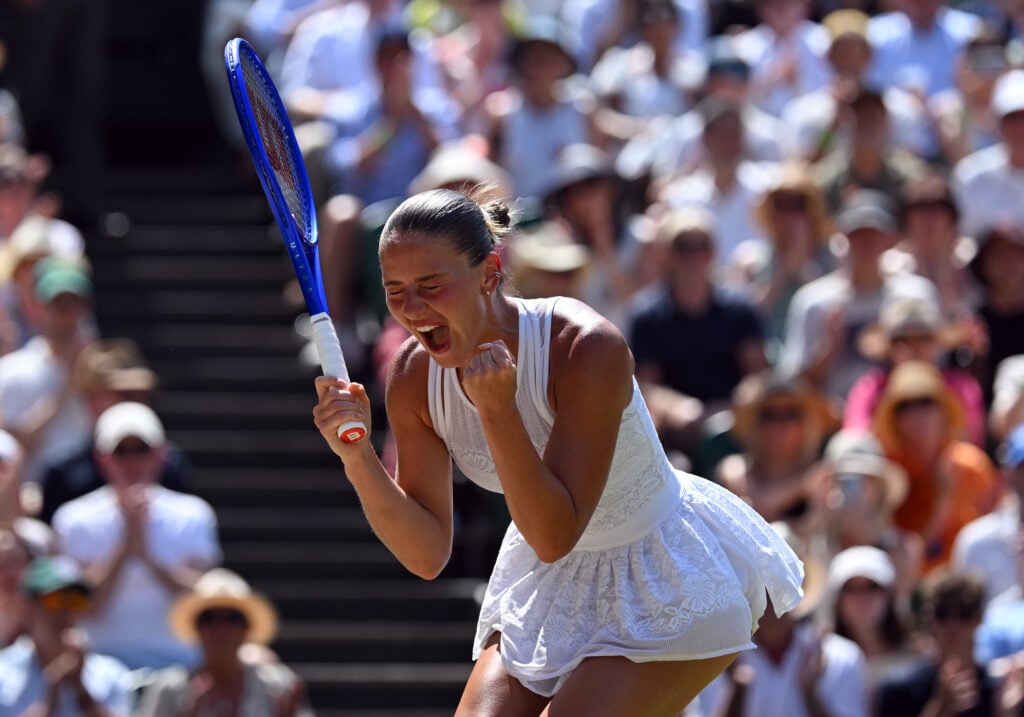 Marta Kostyuk of Ukraine celebrates winning match point against Jasmine Paolini of Italy during their Ladies' Singles quarterfinal match on day ten of The Championships Wimbledon 2026 at All England Lawn Tennis and Croquet Club on July 08, 2026 in London, England.