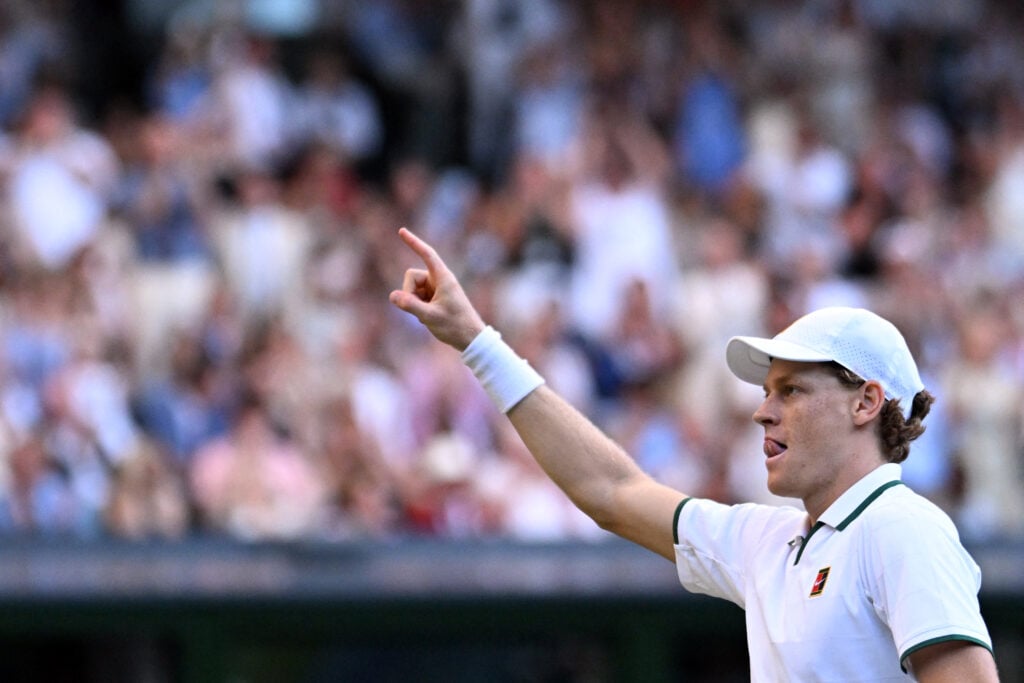 Italy's Jannik Sinner celebrates winning against Germany's Alexander Zverev during their men's singles final tennis match on the fourteenth day of the 2026 Wimbledon Championships at The All England Lawn Tennis and Croquet Club in Wimbledon, southwest London, on July 12, 2026.