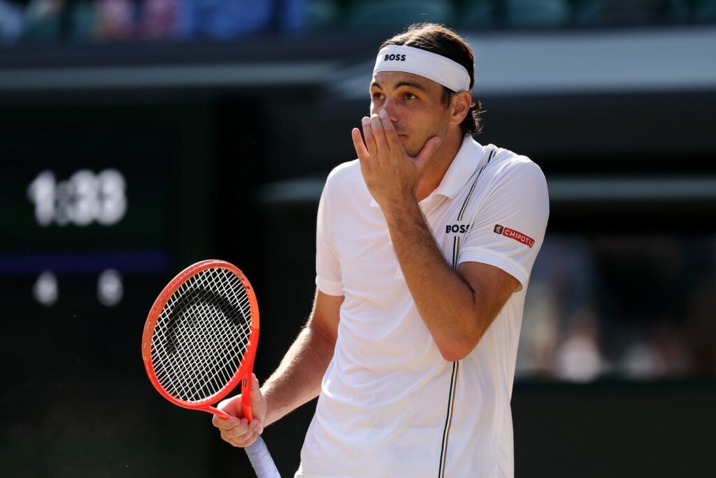 Taylor Fritz reacts during his defeat to Alexander Zverev at Wimbledon in 2026.