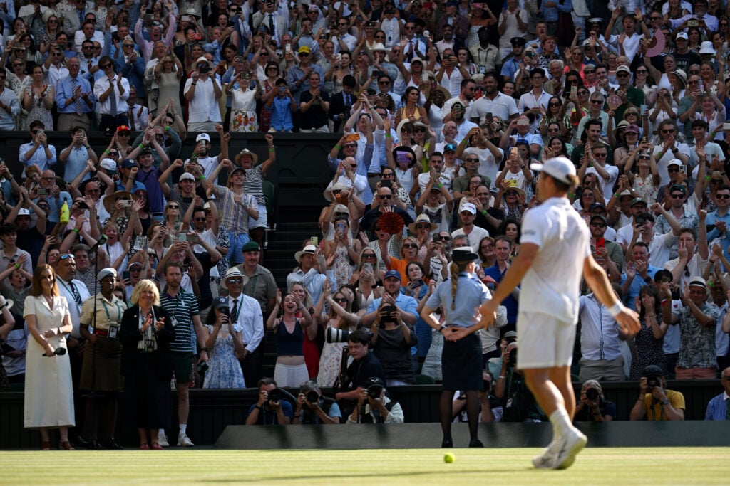 Spectators applaud as Arthur Fery of Great Britain celebrates victory against Flavio Cobolli of Italy during their Gentlemen's Singles quarterfinal match on day ten of The Championships Wimbledon 2026 at All England Lawn Tennis and Croquet Club on July 08, 2026 in London, England.
