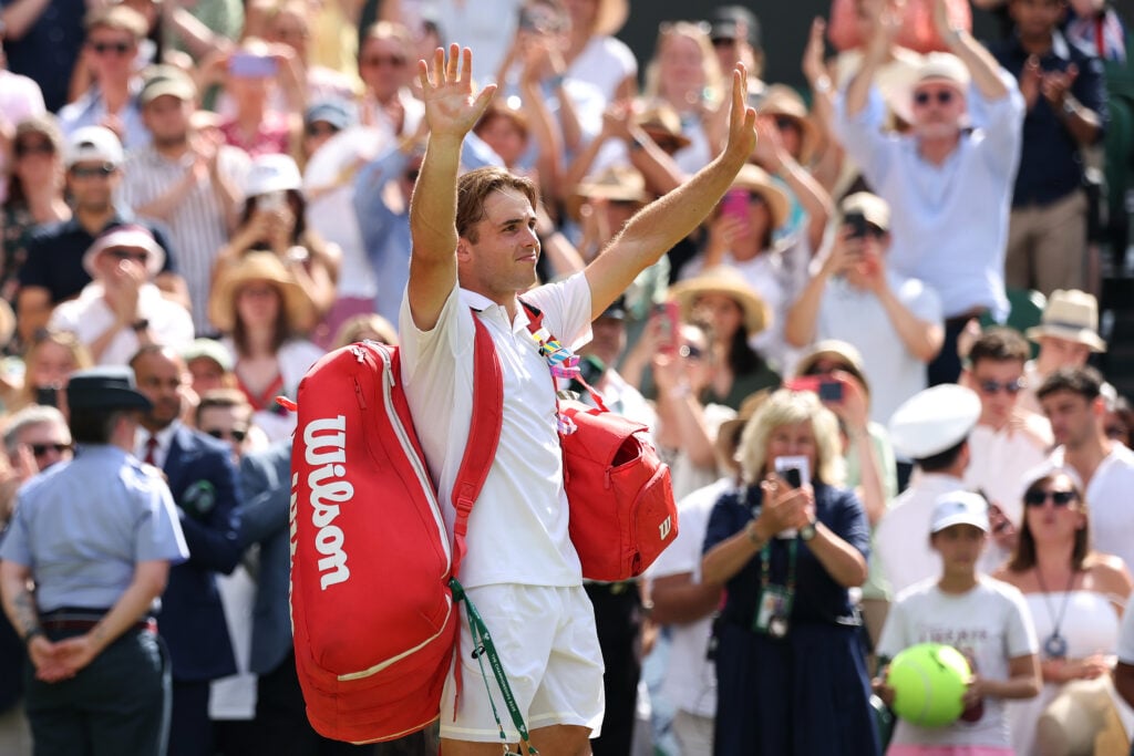 Arthur Fery waves to the crowd after losing to Alexander Zverev at Wimbledon in 2026.