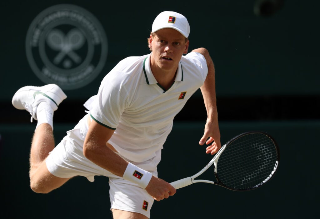 Jannik Sinner hits a serve during the 2026 Wimbledon Championships.