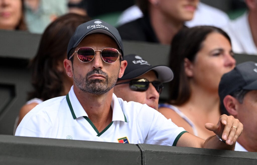 Jannik Sinner of Italy's coach, Simone Vagnozzi sits in his player box during the Gentlemen's Singles semifinal match against Novak Djokovic of Serbia on day twelve of The Championships Wimbledon 2026 at All England Lawn Tennis and Croquet Club on July 10, 2026 in London, England.