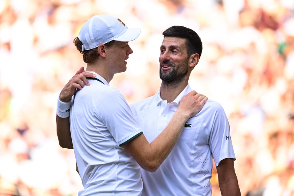 Jannik Sinner and Novak Djokovic exchange after their match at Wimbledon in 2026.