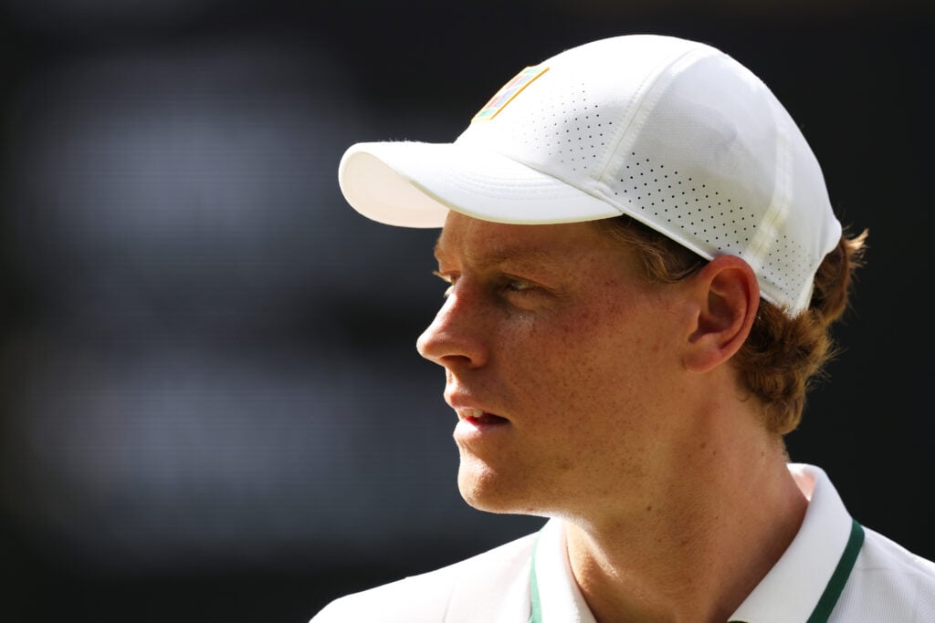 Jannik Sinner of Italy between serves against Novak Djokovic of Serbia during their Gentlemen's Singles semifinal match on day twelve of The Championships Wimbledon 2026 at All England Lawn Tennis and Croquet Club on July 10, 2026 in London, England.