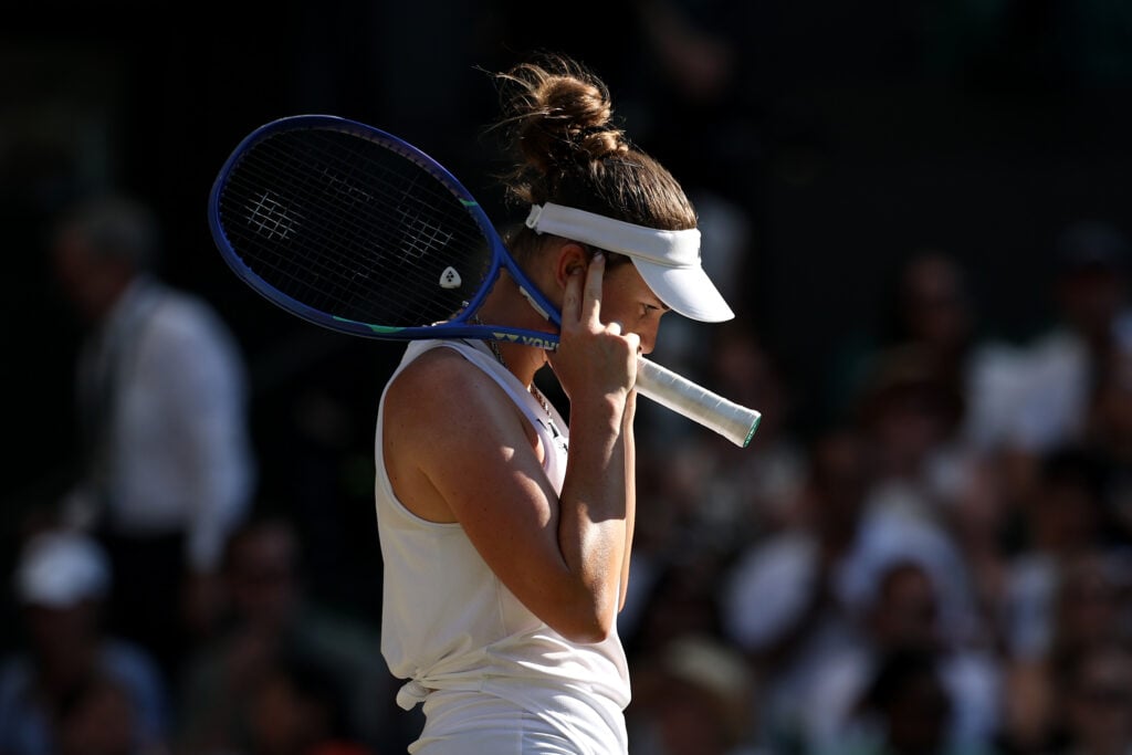 Linda Noskova tries to block out the noise after losing the second set of the Wimbledon final.