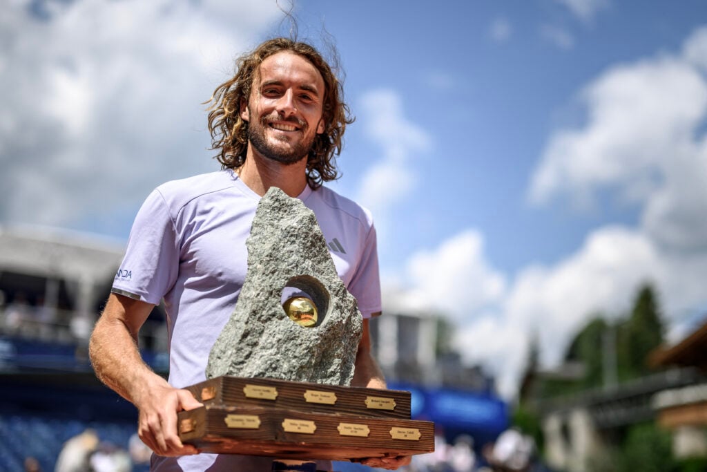 Stefanos Tsitsipas poses with the trophy after winning the 2026 Swiss Open.