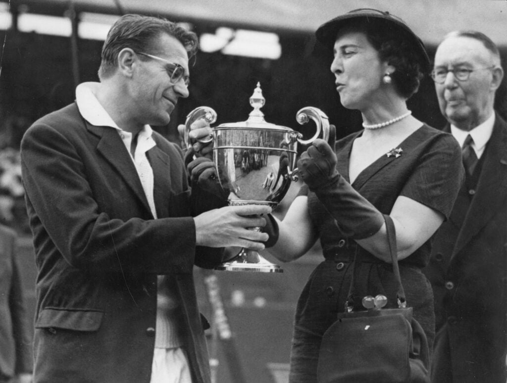Marina, Duchess of Kent, presents the men's singles trophy to Czech-born Egyptian Jaroslav Drobny at the Wimbledon Lawn Tennis Club after he beat Ken Rosewall of Australia.