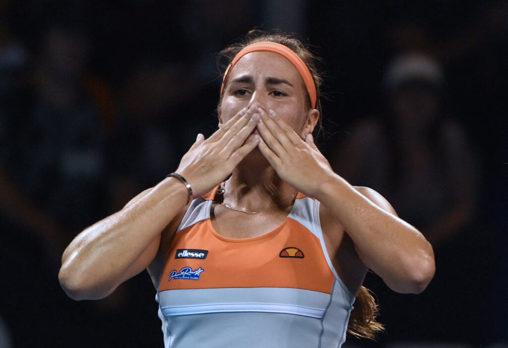 Puerto Rico's Monica Puig gestures as she celebrates after victory in her women's singles match against Czech Republic's Kristyna Pliskova on day three of the 2016 Australian Open tennis tournament in Melbourne on January 20, 2016.