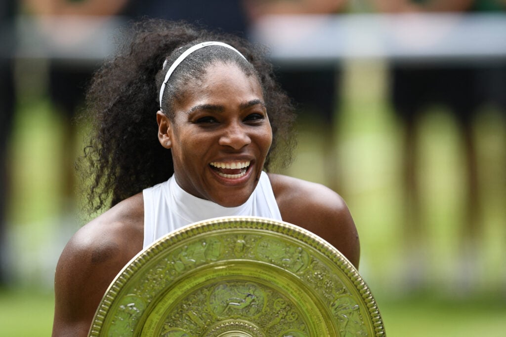 US player Serena Williams poses with the winner's trophy, the Venus Rosewater Dish, after her women's singles final victory over Germany's Angelique Kerber on the thirteenth day of the 2016 Wimbledon Championships at The All England Lawn Tennis Club in Wimbledon, southwest London, on July 9, 2016.