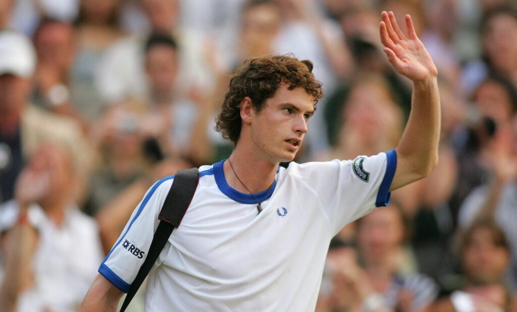 Andy Murray waves goodbye to the crowd after beating Andy Roddick at Wimbledon in 2006.