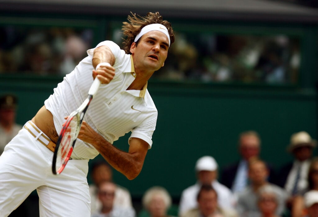 Roger Federer pictured serving during the 2009 Wimbledon Championships.