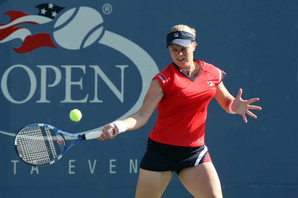 Kim Clijsters of Belgium returns a shot against Marion Bartoli of France during day three of the 2009 U.S. Open at the USTA Billie Jean King National Tennis Center on September 2, 2009 in Flushing neighborhood of the Queens borough of New York City.
