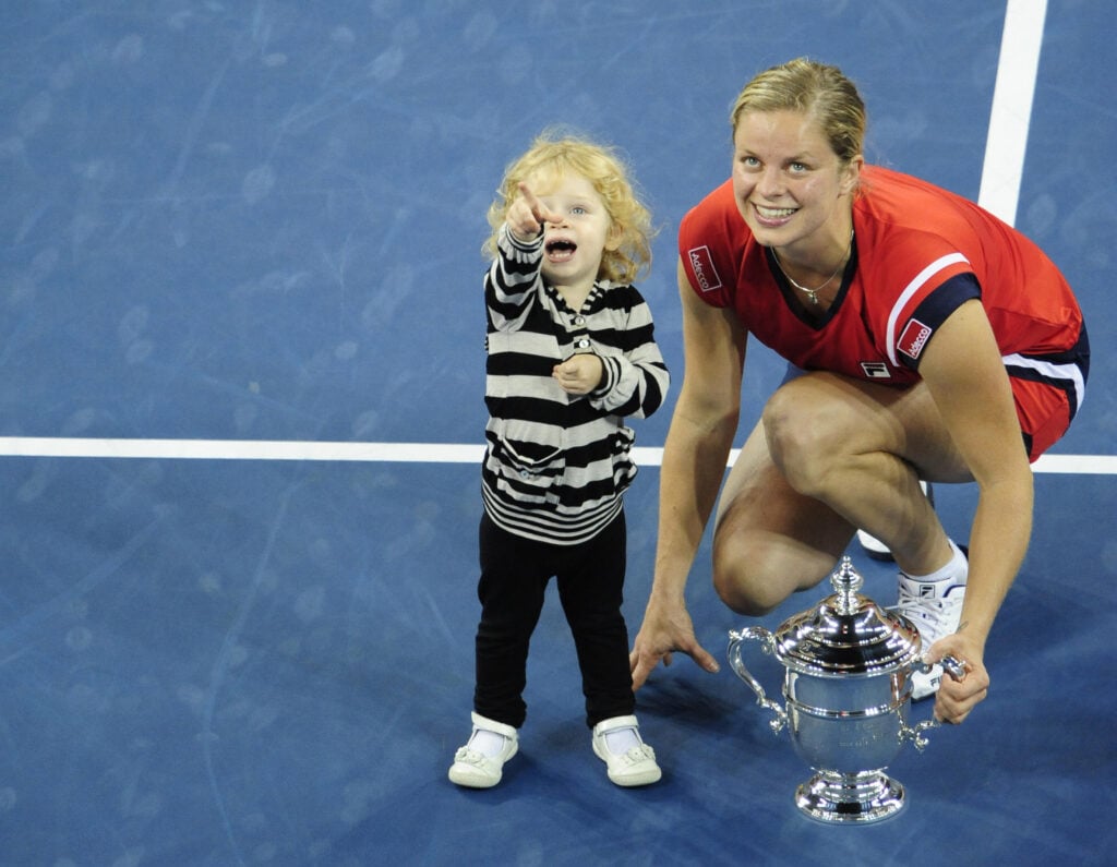 Tennis player Kim Clijsters from Belgium is joined by her daughter Jada after winnings against Caroline Wozniacki from Denmark during the Women's final of the 2009 US Open at the USTA Billie Jean King National Tennis Center, in New York, September 13, 2009.