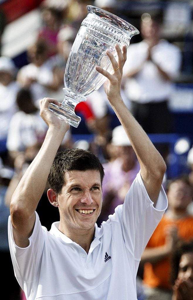 Tim Henman hold the championship trophy after winning his first U.S. championship over Fernando Gonzalez 6-3, 6-4.